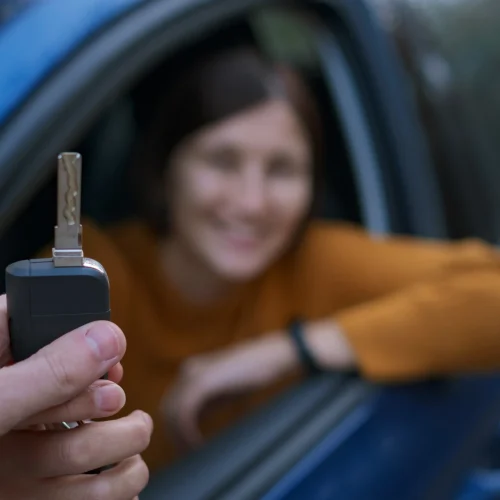 auto-dealer-giving-asian-woman-automobile-key-for-2026-01-07-02-24-09-utc-copy-scaled.webp