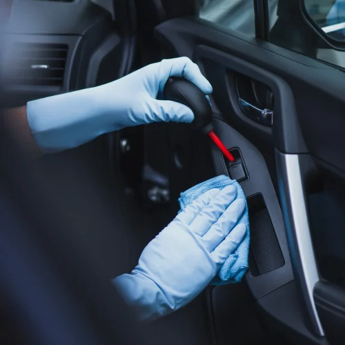 selective-focus-of-car-cleaner-dusting-car-door-wi-2026-01-06-00-39-49-utc-copy-scaled.webp